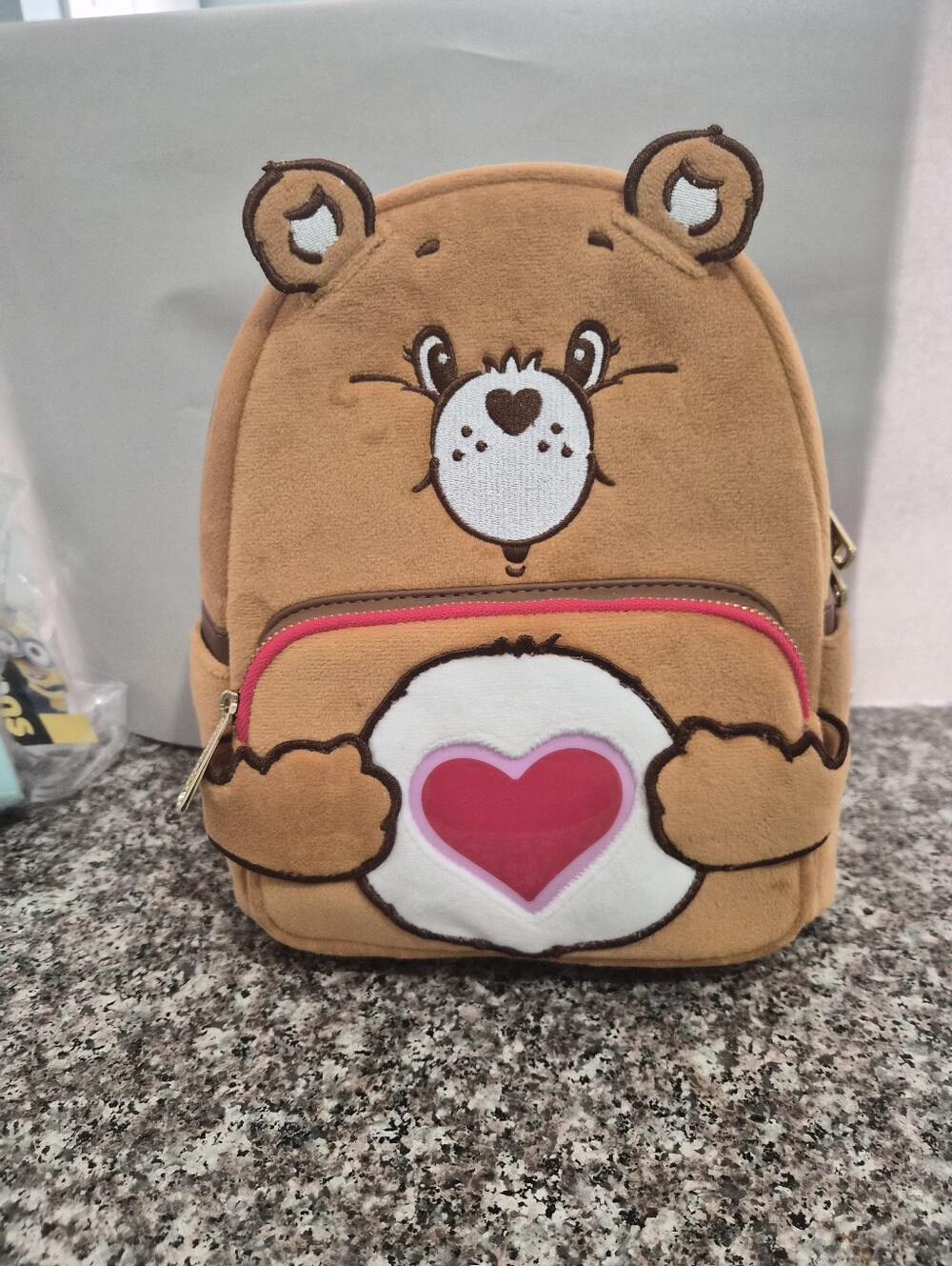 Loungefly Care Bear Plush Backpack with Pink Ligh Up Heart.